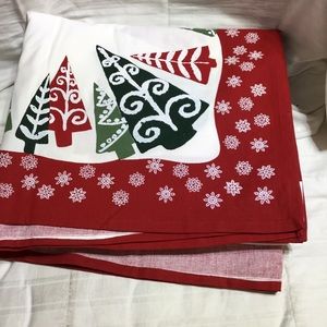 Holiday tablecloth, NWOT, 60”x 104”, tree and snowflake or presents motif